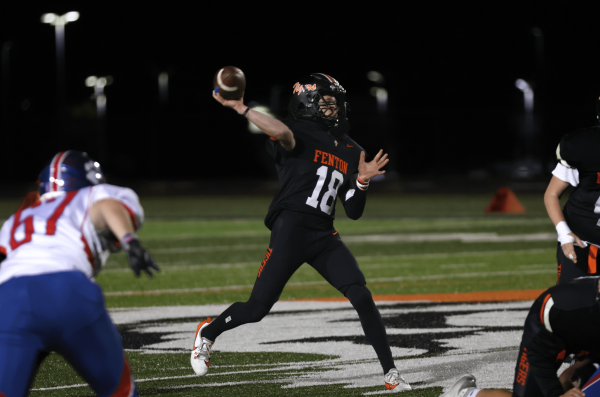 Throwing, Freshman. Rhys Sheil prepares to throw the ball to his receiver. On Oct,24  the JV football team lost to Mason 21-35.