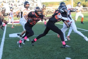 Pushing, freshman Logan Christopher ran through the Flushing defensive line to get the ball across the field. On Oct. 10 Fenton beat Flushing Highschool (42-7)