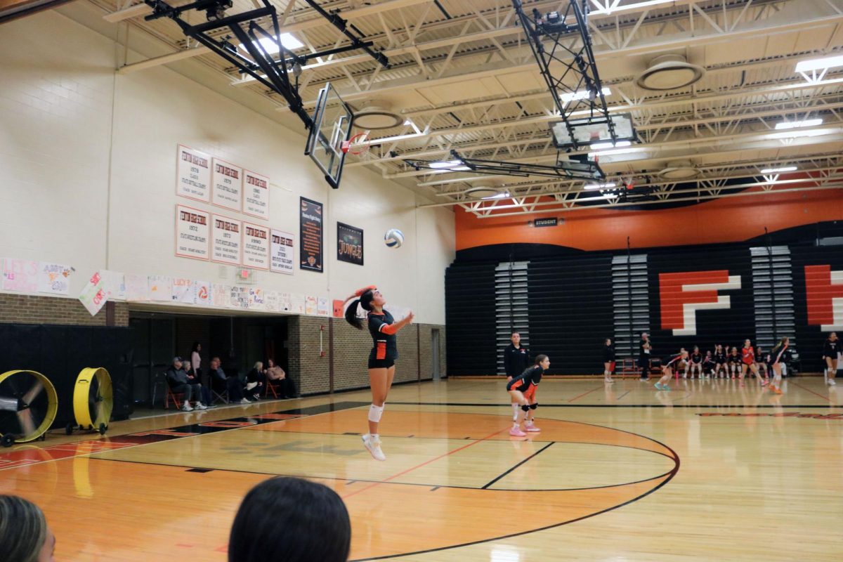 Jumping, freshman Alejandra Ayotte sets the ball to Flushing. On Oct. 15, Fenton JV volleyball competed against Flushing winning 2 out of 3 in their sets. 
