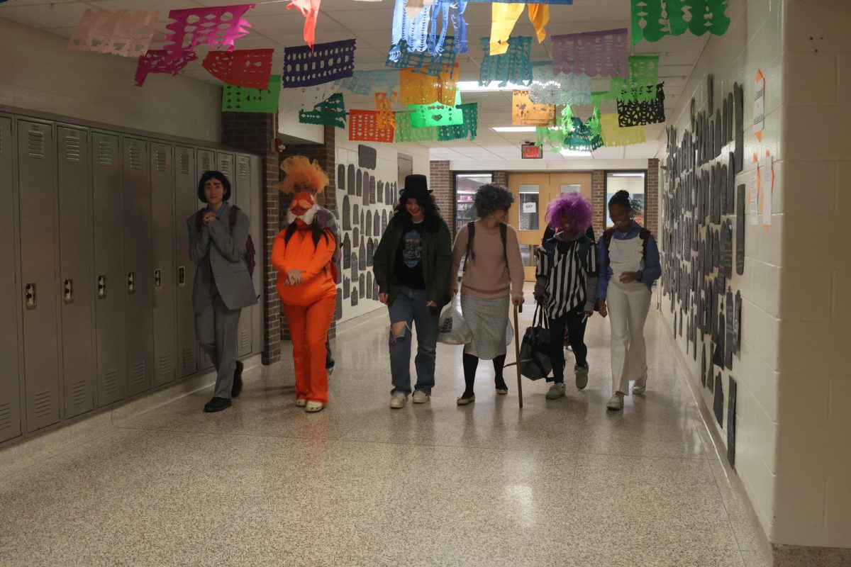 Walking together, seniors Brooke Waters, Rayn Rutley, Bella Butzine, and Laila Blackwell participate in Halloween spirit week. On Oct. 28 FHS held Movie Monday for students to celebrate Halloween.