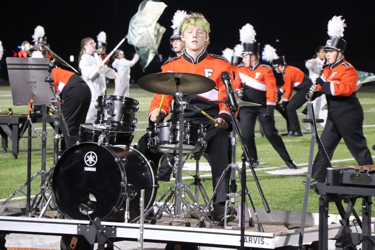 Performing, freshman William Corry plays the drums. On Sept. 20, the FHS Marching Band put on their show for halftime.