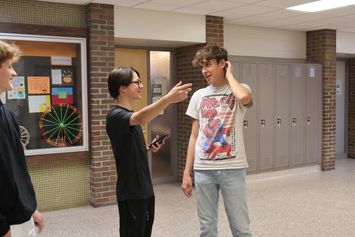 Talking, sophomore Gentry Watson prepares to film. On October 21, Video 1 filmed for a class project.  