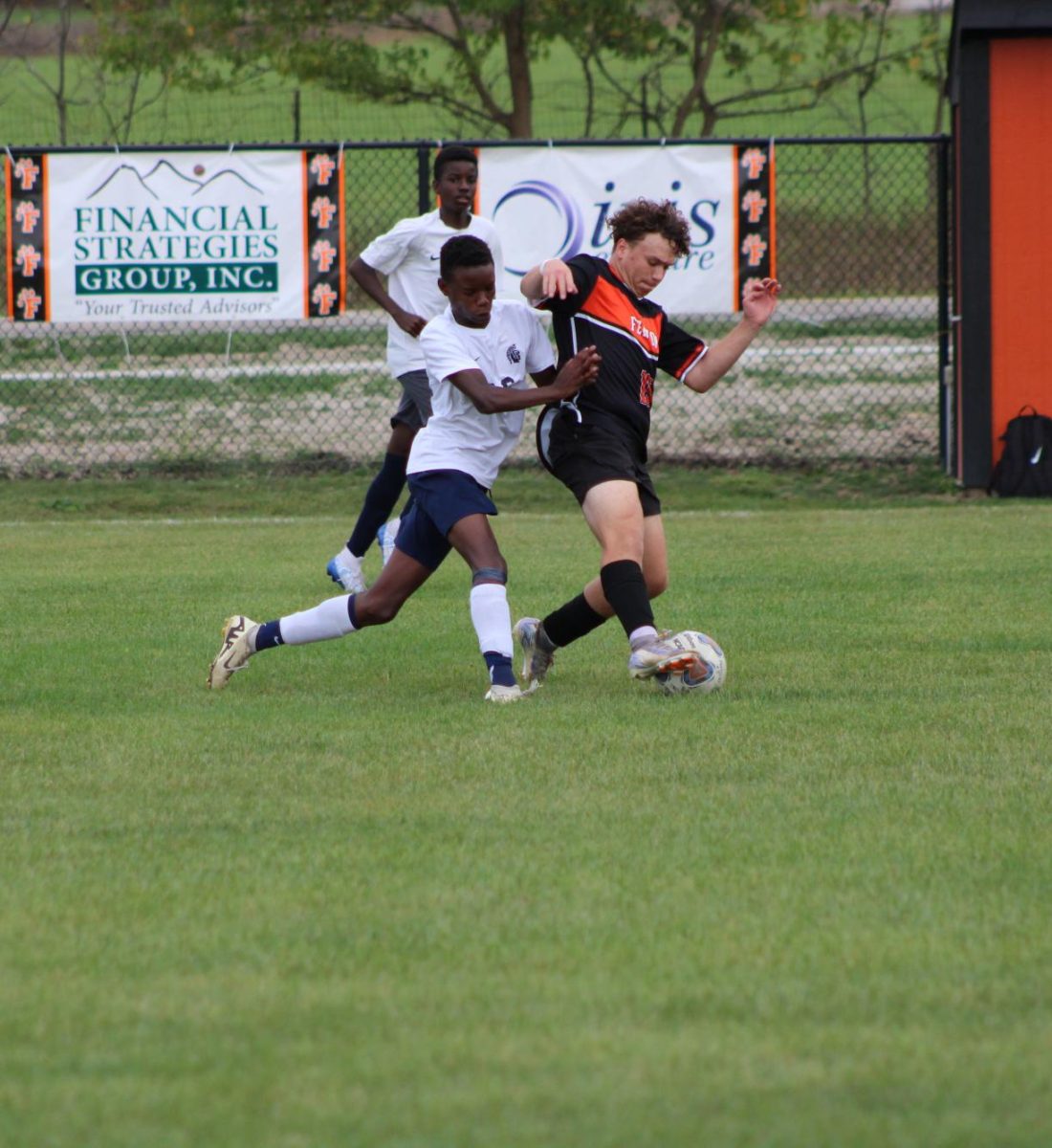 Kicking the ball, junior Riley Barnhill tries to keep it away from the defender. On Sept. 26, the JV soccer team played Goodrich winning 2-1.