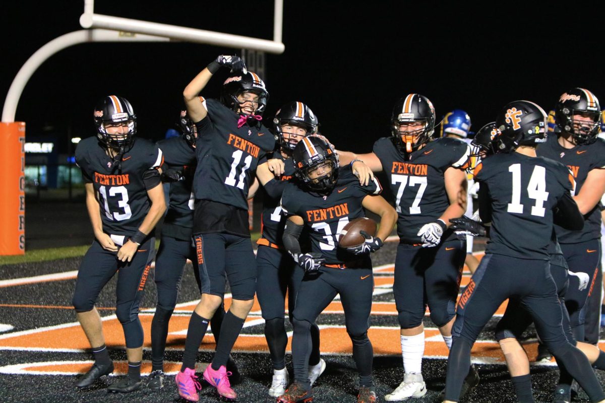 Celebrating, senior Mario Anthony Yap gets his first touchdown. On Sept. 27, Fenton varsity football went up against Kearsley winning 41-6.