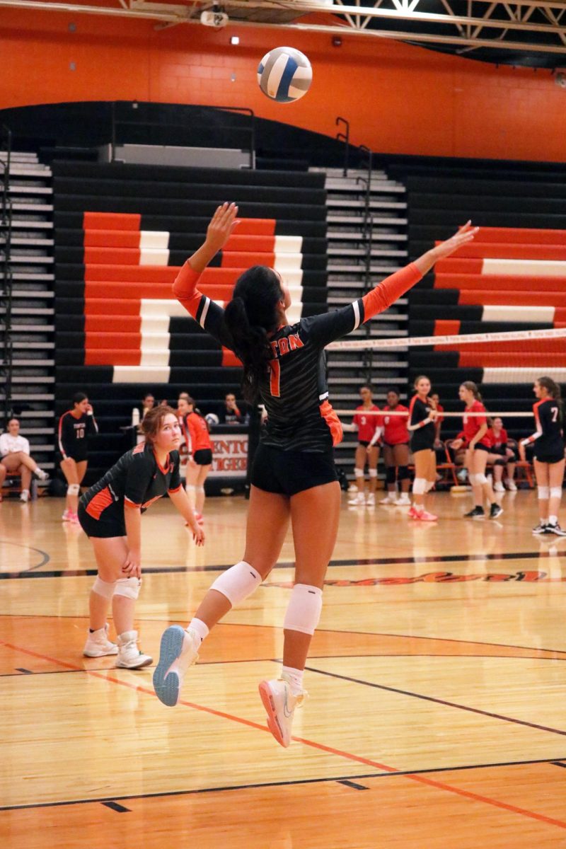 Jumping, freshman Alejandra Ayotte serves to Swartz Creek. On Sept. 30, Fenton competed with Swartz Creek winning all three sets.