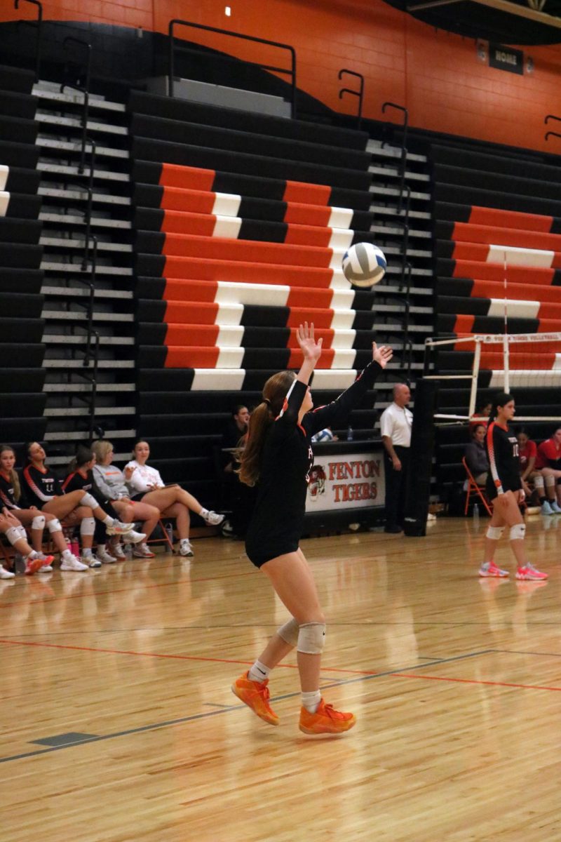 Serving freshman Amaria Dallas starts the game.  On Sept. 30, Fenton goes against Swartz Creek winning all three sets. 