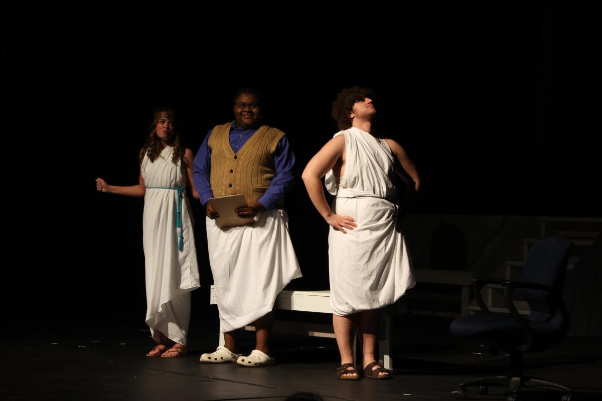 Facing away, sophomore Hudson Dyer acts in the first scene alongside seniors Donnel Hall and laila Blackwell. On Nov. 8, the drama class held the first Greek play. 