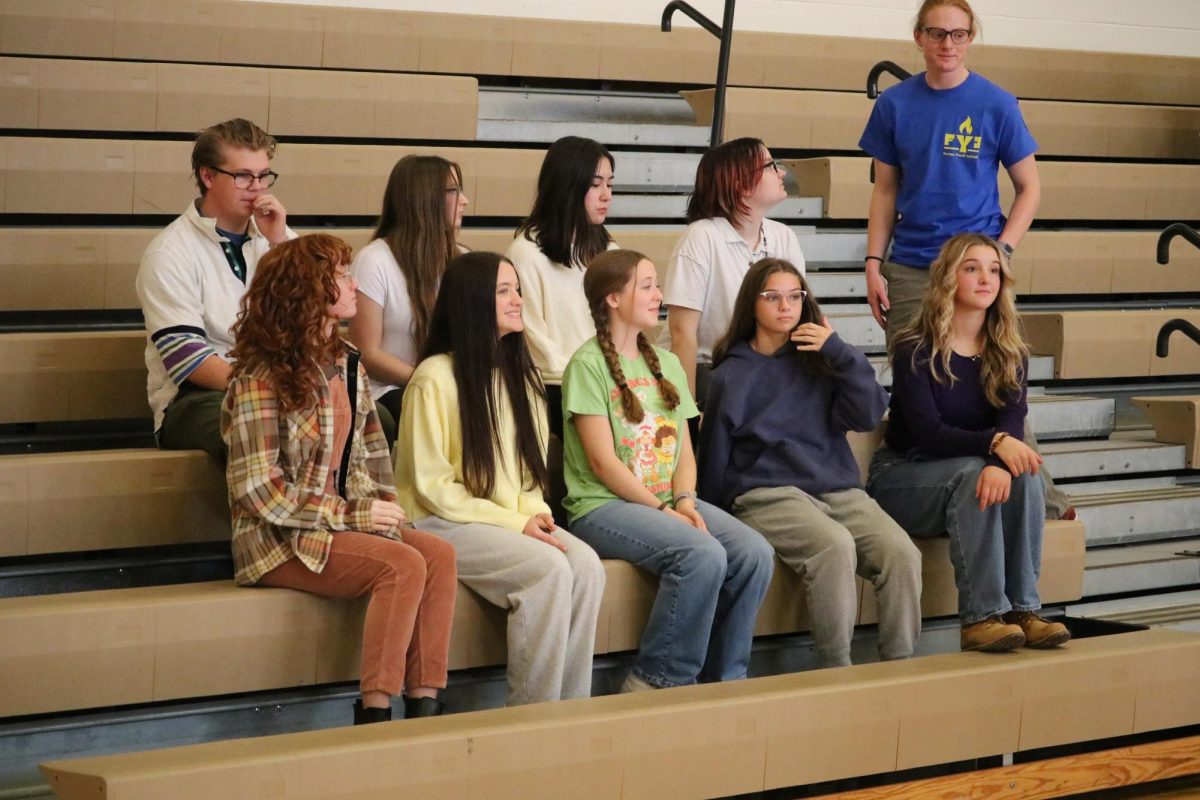 Waiting, the National Art Honor Society sits to have their picture taken. On Nov. 12, FHS held club photos in the Aux Gym.