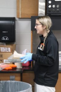 Standing in line, senior Shyanne Baker waits to get her test sample. On Oct. 30, anatomy performed sheep brain dissections in class.