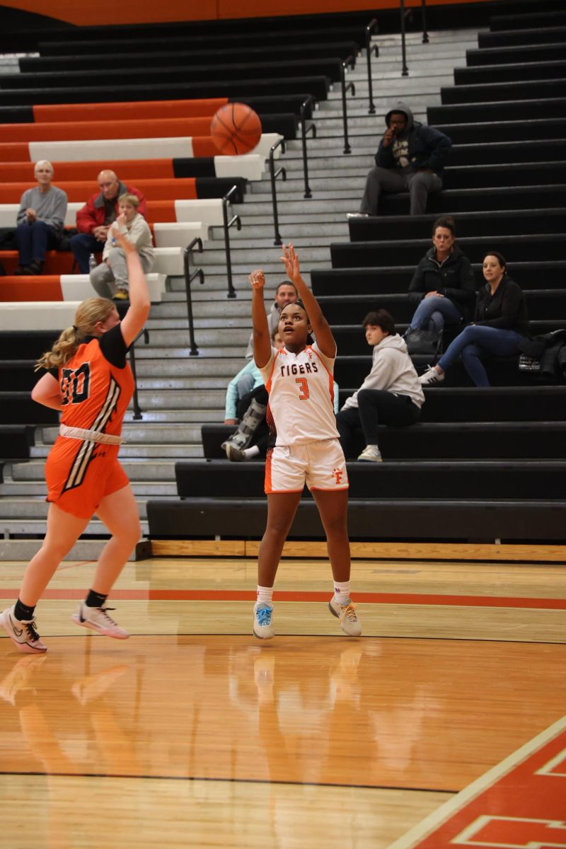 Shooting the ball, sophomore Reia Westbrook attempts to score. On Dec. 6, the JV girls basketball team played Clio and won.