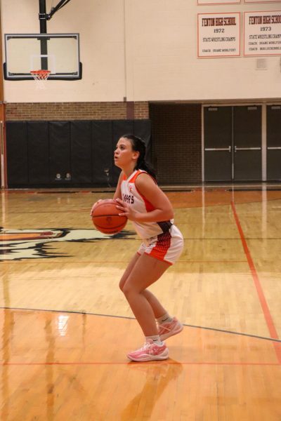 Shooting the ball, freshman Olivia Gurnsey attempts to score. On Dec. 6, the  JV girls basketball team played Clio and won.