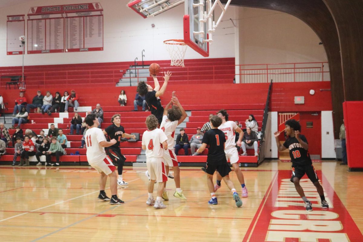 Jumping, freshman Deton Thommen is going for the lay-up. On Dec. 5, the freshman boys basketball team played against Swartz Creek and took the win.