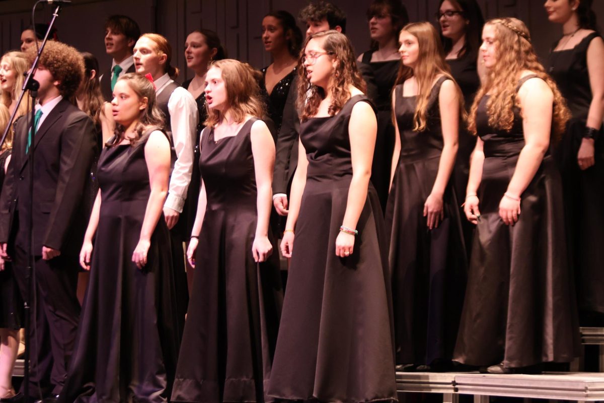 Singing, the Fenton Ambassadors sing a Christmas song. On Dec. 12, the Ambassadors had a Christmas concert.