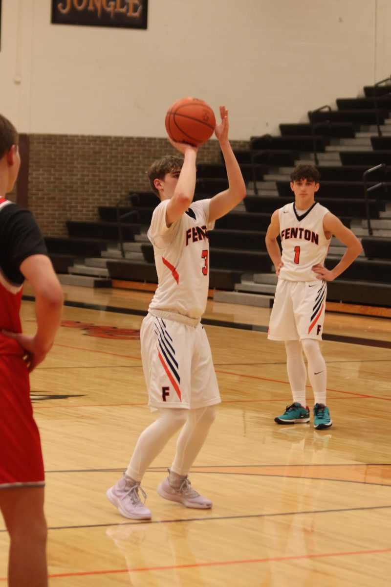 Shooting, sophomore Spencer Irwin shoots his two free throws. On Dec. 12, the JV Tigers played Holly High winning 51-50. 