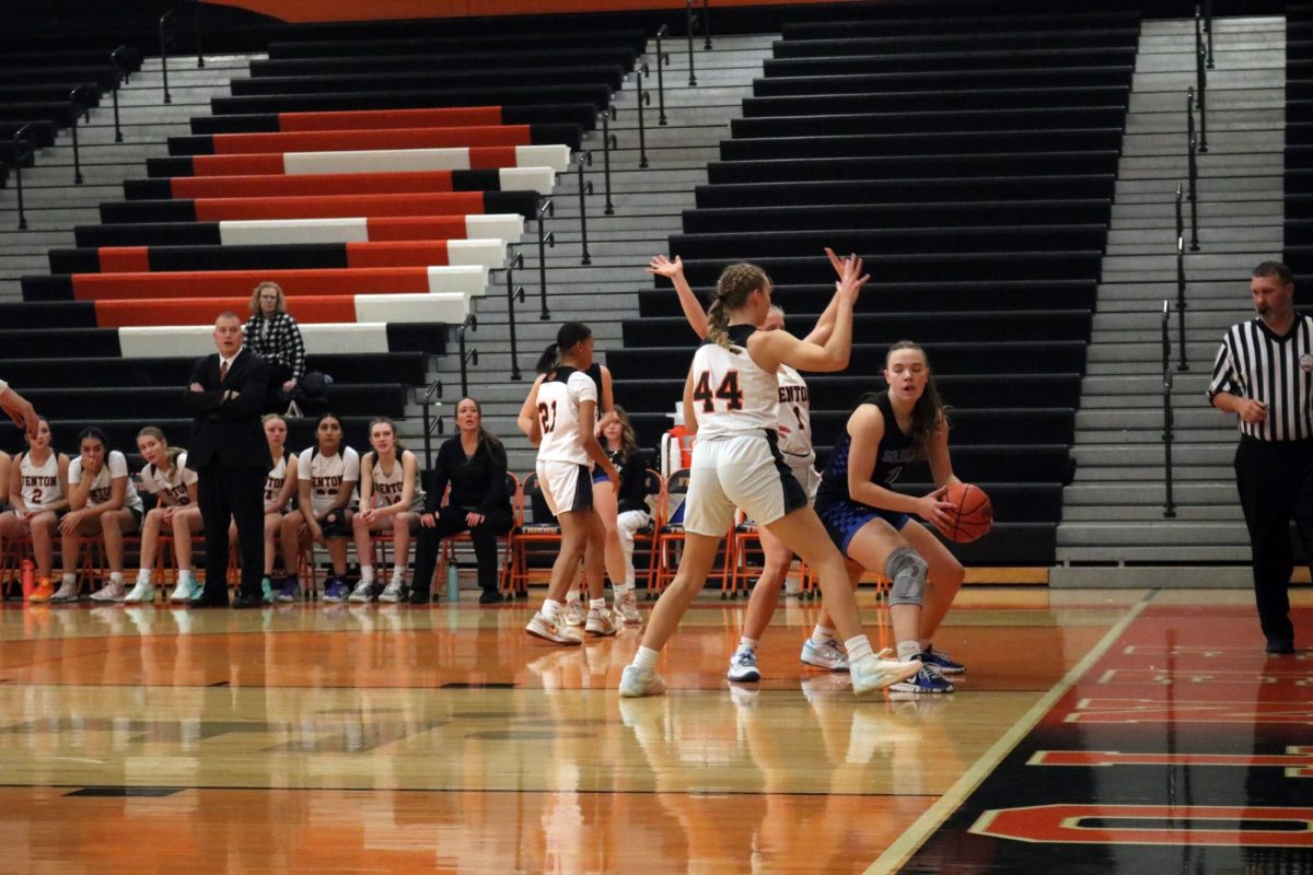 Blocking, sophomore lucy Weber and senior Izzy Mccaughan guard as the opposing team has the ball.  On Dec. 2, Fenton varsity girls basketball VS.  Genesee Christian putting up a tough fight. 