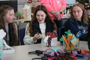 Surprised, junior Haven Selby is excited to receive her gift. On Jan. 10, The Fentonian yearbook staff did a secret santa exchange.