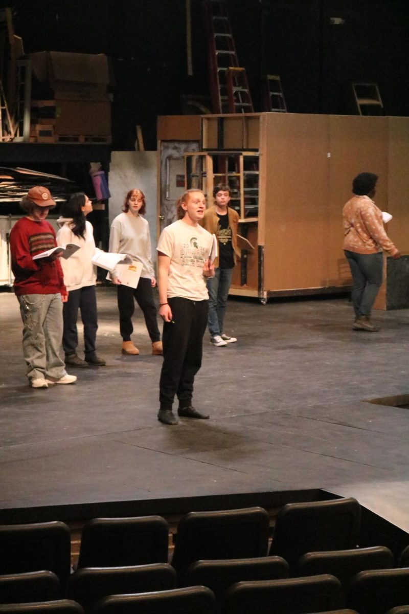Singing, junior Ash Wholmes performs for the school musical. On Jan. 15, FHS theater students rehearsed their rendition of Willy Wonka the musical. 