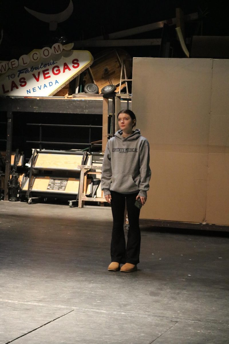 Waiting for her cue, sophomore Madi Rohde rehearses her lines. On Jan. 17, theater students spent freetime preparing for their upcoming musical. 