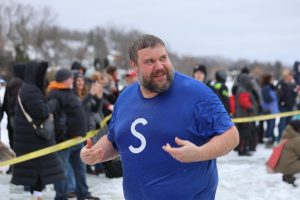 Freezing, Assistant Principal Zach Bradley returns to the building after jumping in the Polar Plunge for the special olympics. On Feb 1, Lake Fenton held their annual Polar Plunge.