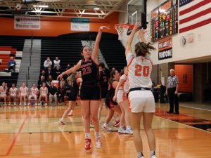 Shooting, senior Peyton Larowe takes the shot.  On Feb. 7, Fenton girls varsity basketball put up a good fight against Linden. 