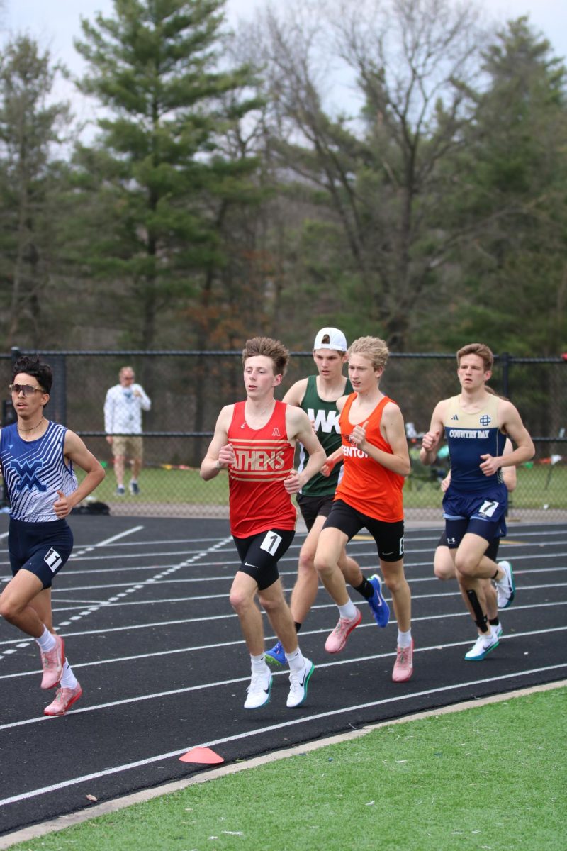 Pacing himself, freshmen Gavin Katic runs in a pack. On April 18, the Fenton track team went up against multiple other schools at Brandon High. 