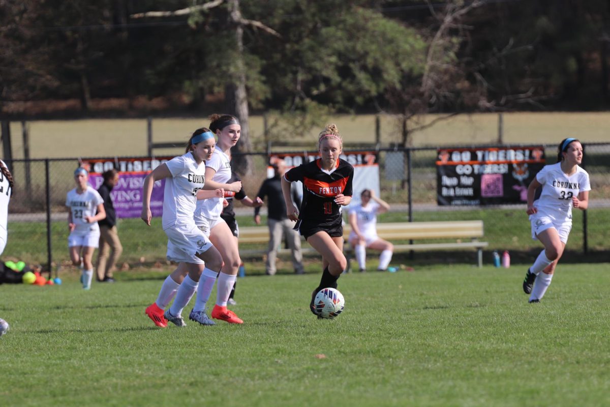 Dribbling, sophomore Payton Roney kicks the ball along the field. On April 15th, the Girls JV soccer team played Corunna.