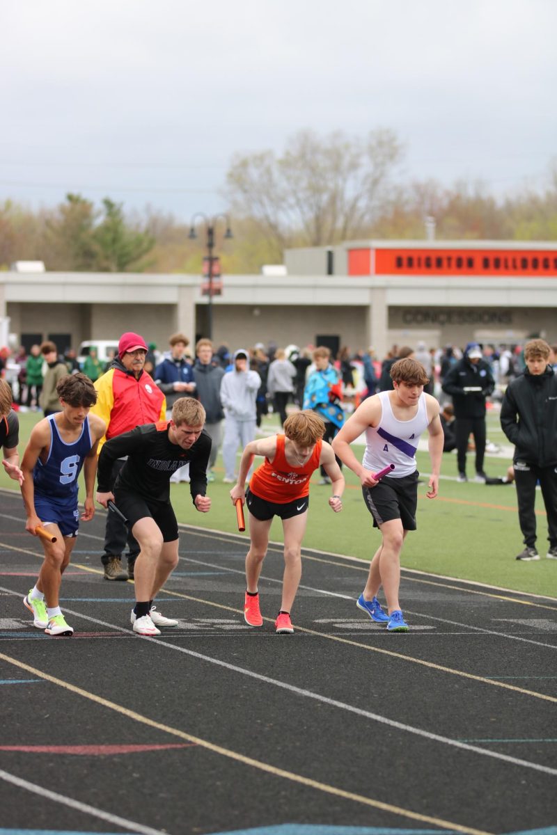 Getting ready, sophomore Ben Panter runs his leg of the 4x800. On  April 26, the FHS track team ran at the Brighton Bulldog Invitational. 