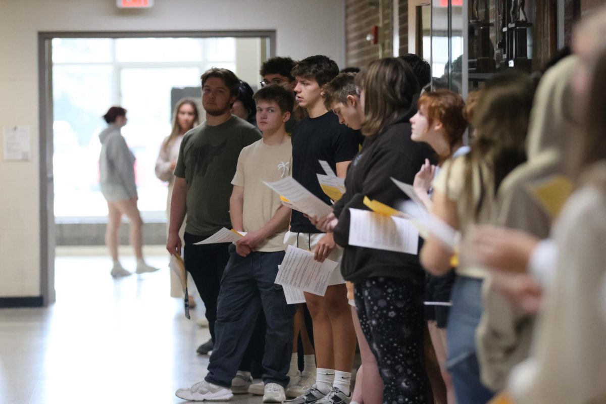 Standing, the NHS induction class listens to Mrs. Hazlett talks about induction night. On April. 24th Mrs Hazlett held a practice for the NHS ceremony.