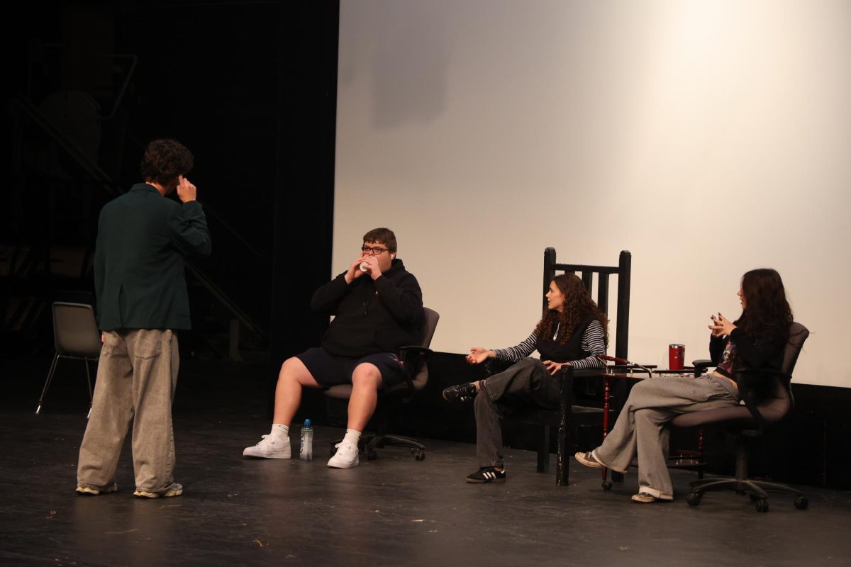 Testing a product, junior Hunter Sayer yells into a cup. On May 23, advanced video recorded an episode of Shark Tank. 