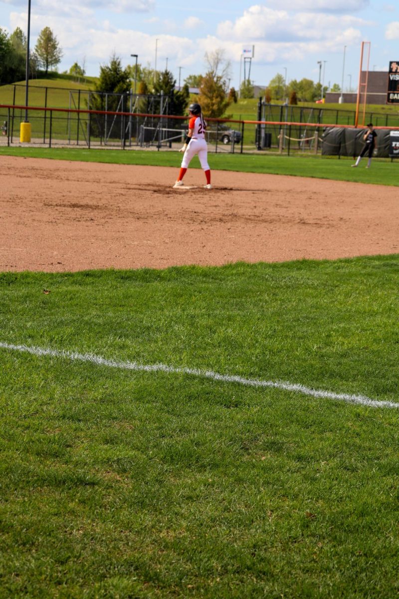 Waiting, junior Lily Underwood prepares to play softball. On May 7, the FHS JV girls softball team played against Walled Lake Northern High. 