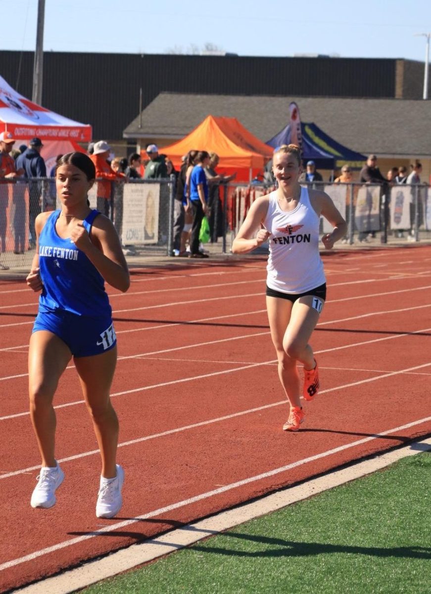 Sprinting, junior Reese Canada attempts to pass a Lake Fenton runner. On May 9, FHS girls and boys varsity track competed at Linden High. 