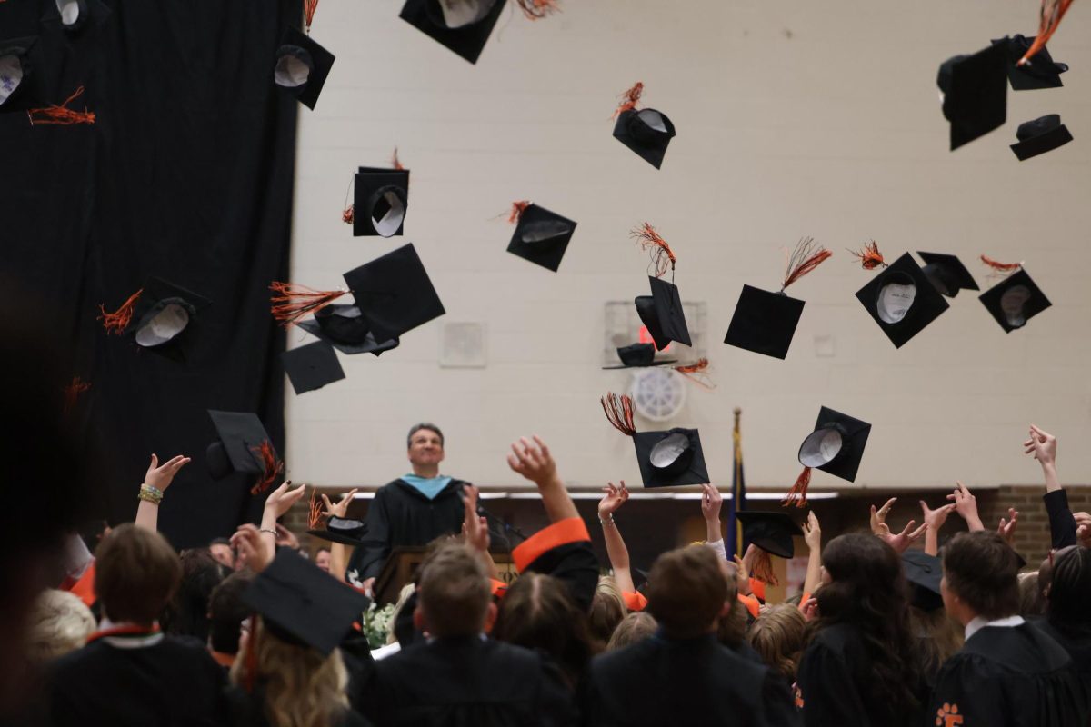 Throwing their hats, the seniors graduate. On May 22, FHS held graduation in the gym.