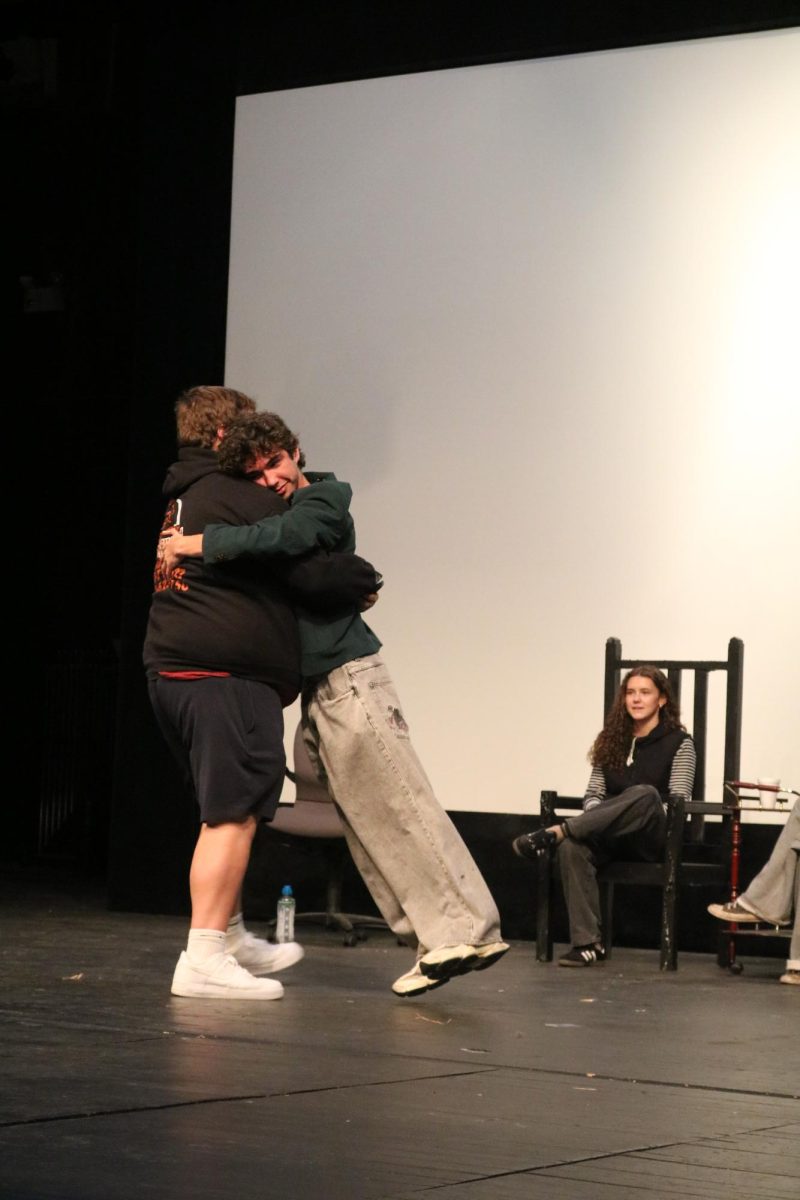 Hugging, juniors Owne Baize and Hunter Sayer perform an episode of Shark Tank. On May 23, advanced video film an episode for the FHS news.