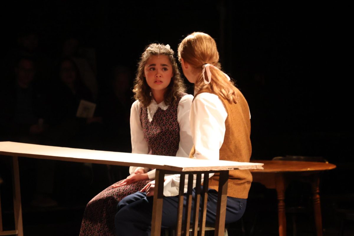 Looking, senior Laila Blackwell acts in a play. On May 2, FHS put on a production of the play "Our Town."