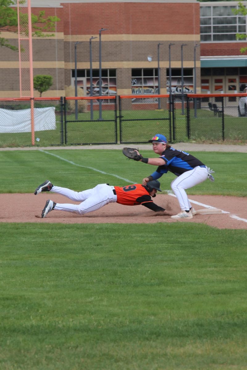 Sliding, sophomore Davis Metcalfe reaches for second base. On May 19, Fenton competed against Brandon and won with a 6-0 deficit. 