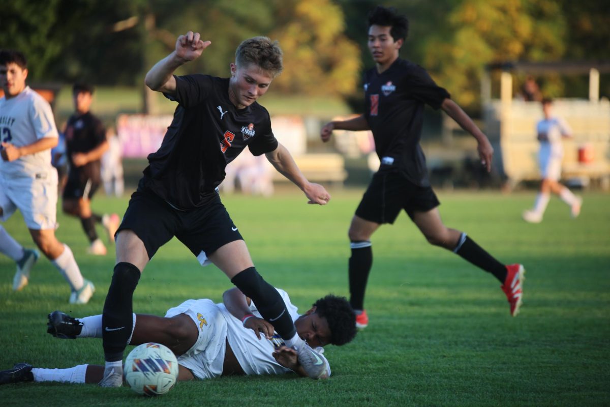 Guarding the ball, junior Grant Geiersbach steals the ball from Kearsley. On sept. 17 Fenton varsity soccer won 8-0 against Kearsley high school. 