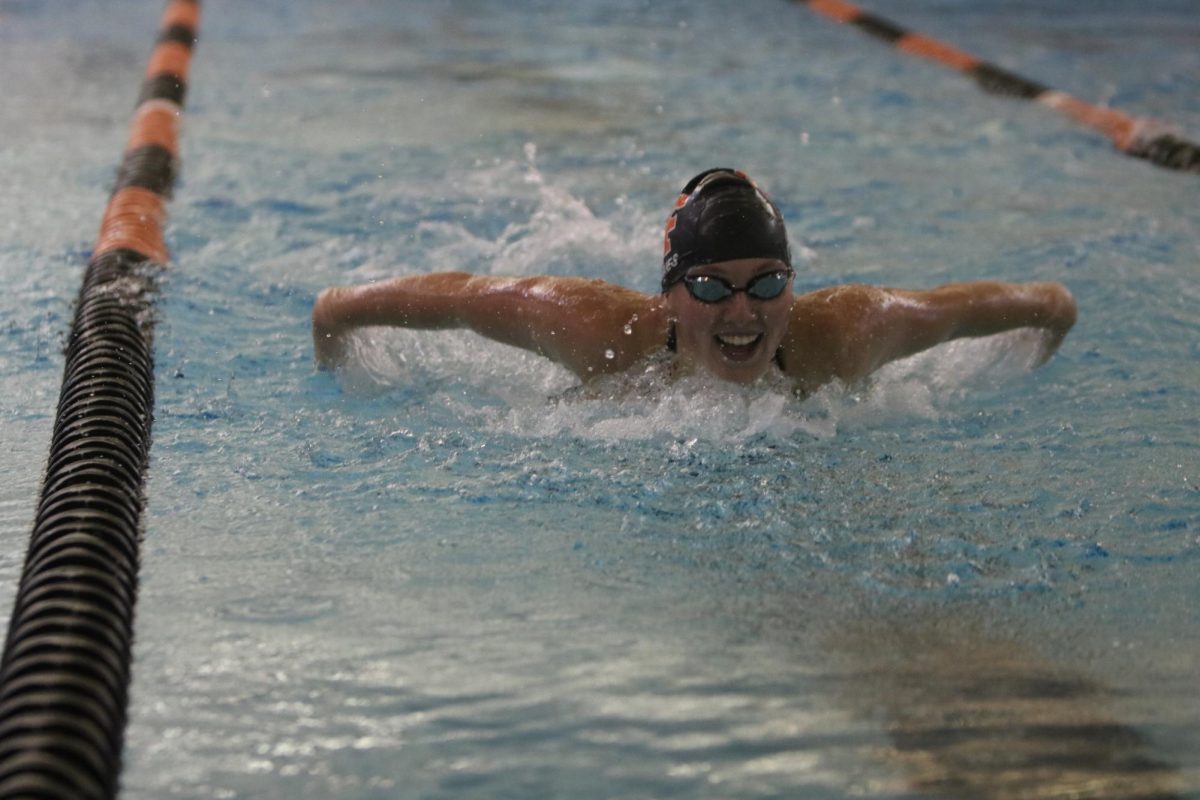 Butterflying, senior Josie Fries races at a meet. On Sept. 8, the Fenton Varsity Girls Swim and Dive team had a meet against Walled Lake Northern High and won.