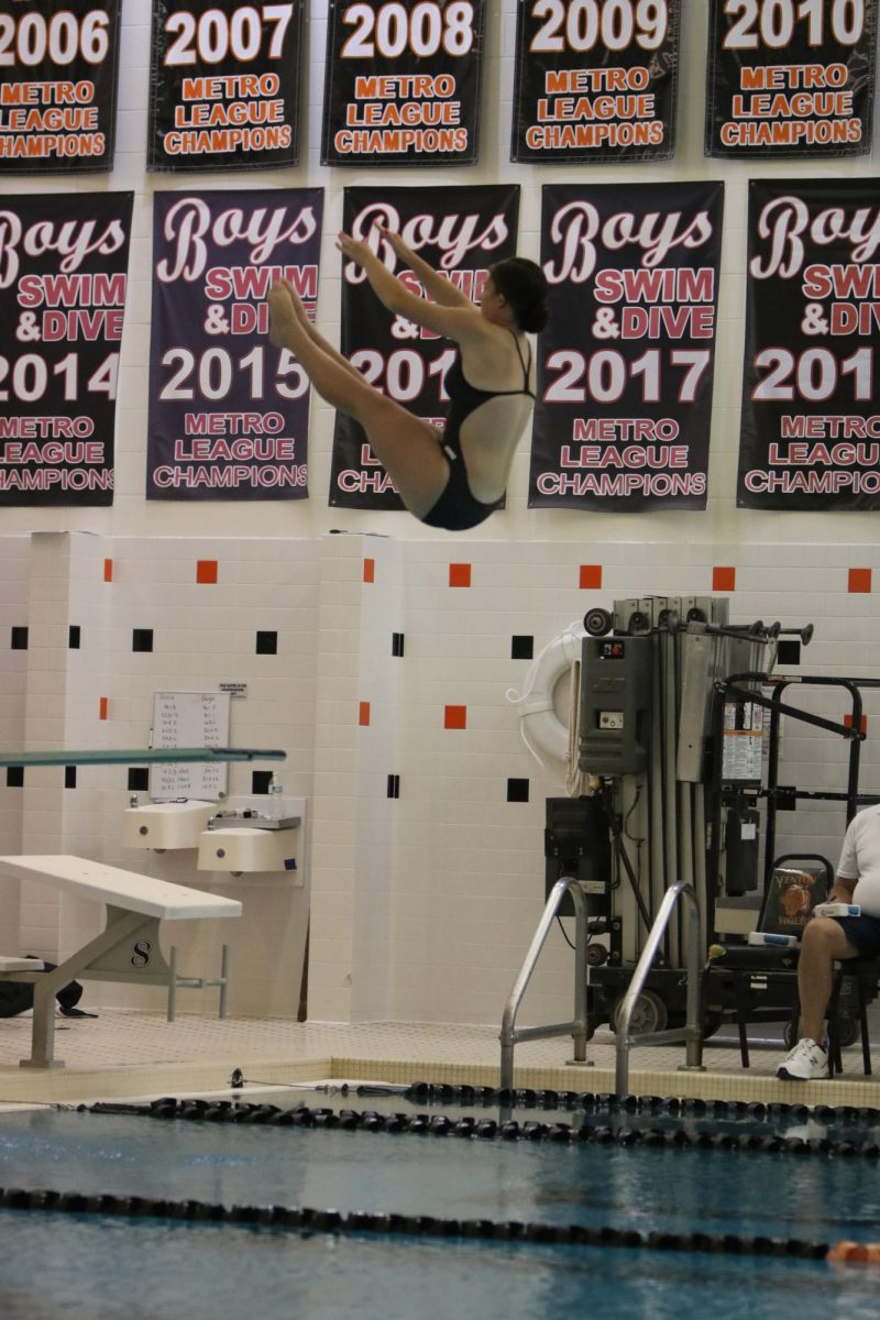 Diving, junior Jessie Livingston competes at counties. On Sept. 18, the Fenton Swim and Dive team had their prelims held at Fenton for counties.