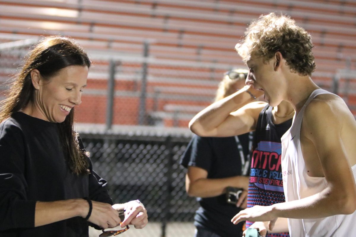 Yelling out loud sophomore Gavin Katic gets riled up for his race against his team. On Sept. 18, the boys Cross Country team participated in Ball Run Night, where they slept on the field and played a variety of competitive games.