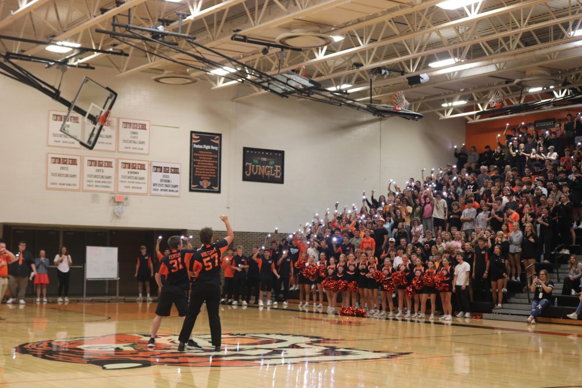 Dancing, seniors Michael Farris and Max Wolfram compete in a dance competition on Sept. 19 at the homecoming pep rally as the senior class cheer them on.
