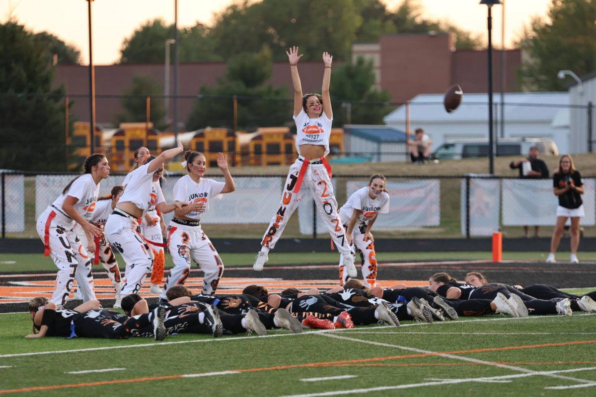 Jumping for the ball, junior Mina Hunt attempts to catch the ball. On Sept. 15, juniors and seniors played against each other in the powderpuff game. Seniors won 40-14. 
