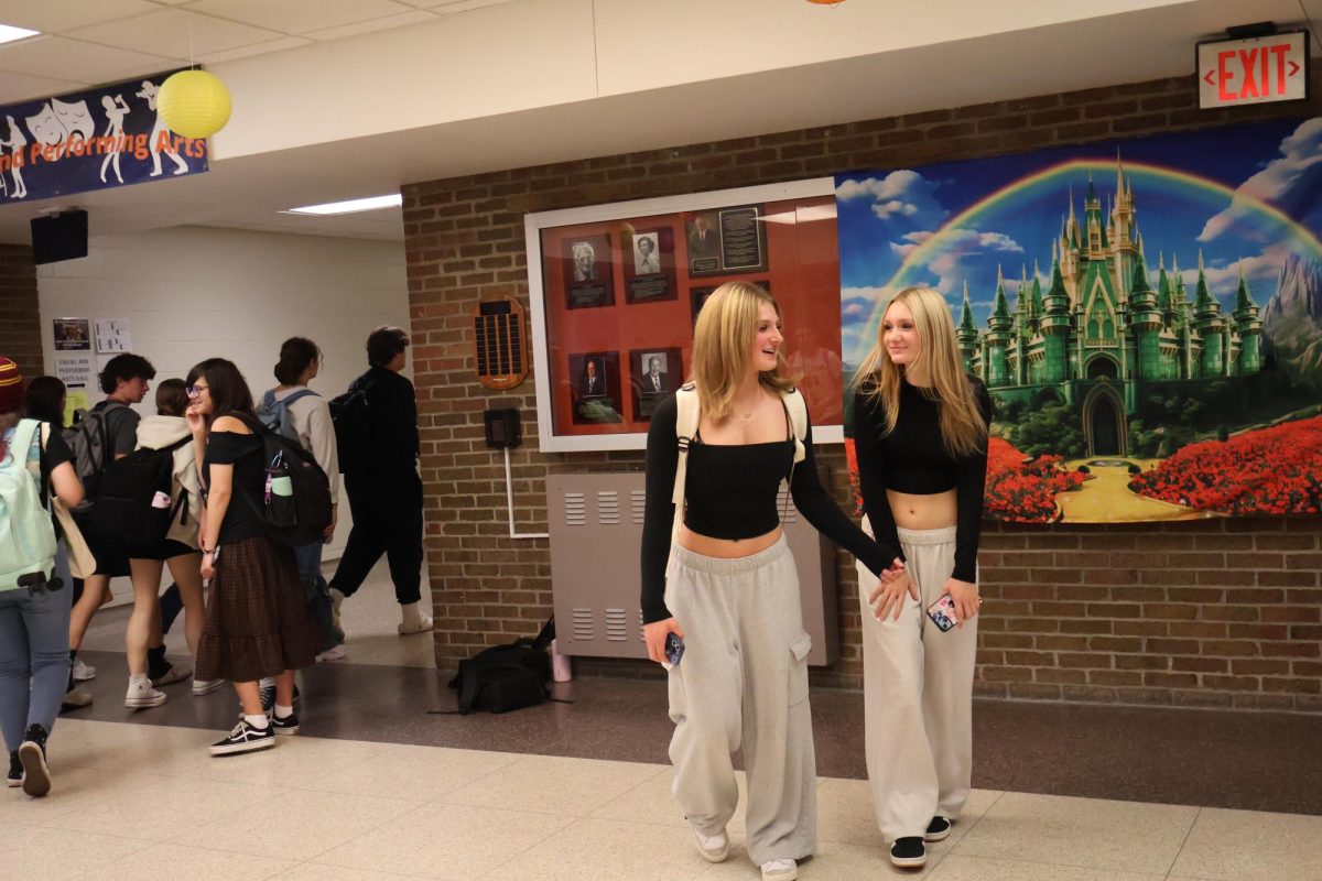 Smiling, sophomore Haley Duncan and Isabel Freeby are walking down the hallway together. On Sept. 16, they are twinning for HOCO Spirt Week.