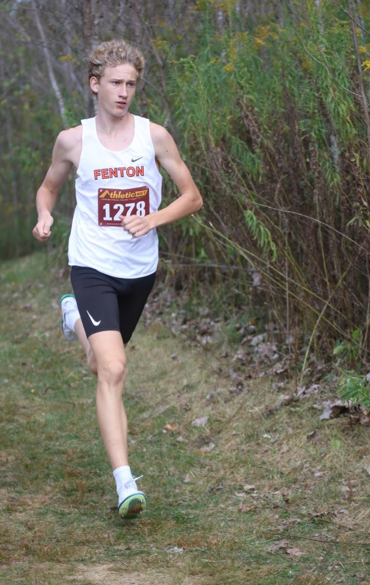 Running, sophomore Gavin Katic starts off the race in first place. On Sept. 24, Fenton went up against Linden and placed 2nd.