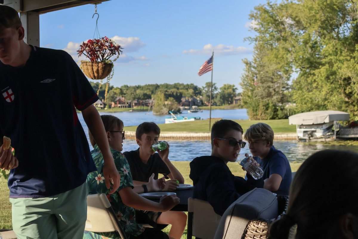 Drinking, freshmen, Anderson Frieden, William Hollenbeck, Joshua Goode, and Tycen Cole fuel up at the pasta party. On Sept. 2nd, the Cross Country team held a pasta party the night before a meet.
