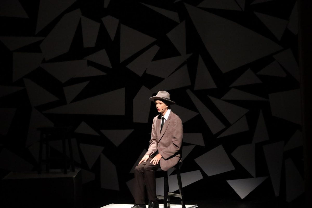 Talking, sophomore Lennon Paxton plays his part in the FHS fall play. On Oct. 2,3,4, Fenton had their fall play called trap, a fun time for the cast and audience alike.