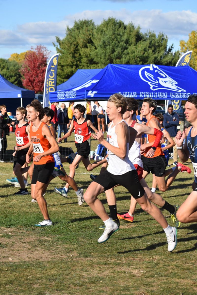 Running in a Jamboree, sophomore Gavin Katic races in a 5k. On Oct. 15 he got first place with a time of 16:06.09 and Fenton varsity boys placed 2nd overall.