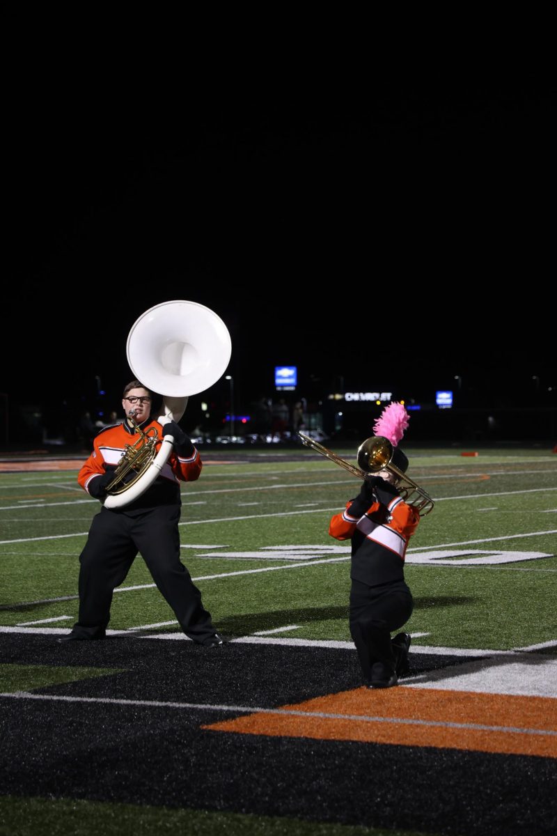 Preforming at halftime of the friday football game, senior Jonathan Nichols is playing the sousaphone. On oct. 10 at the Fenton vs Linden football game the fenton band preformed during half time. 
