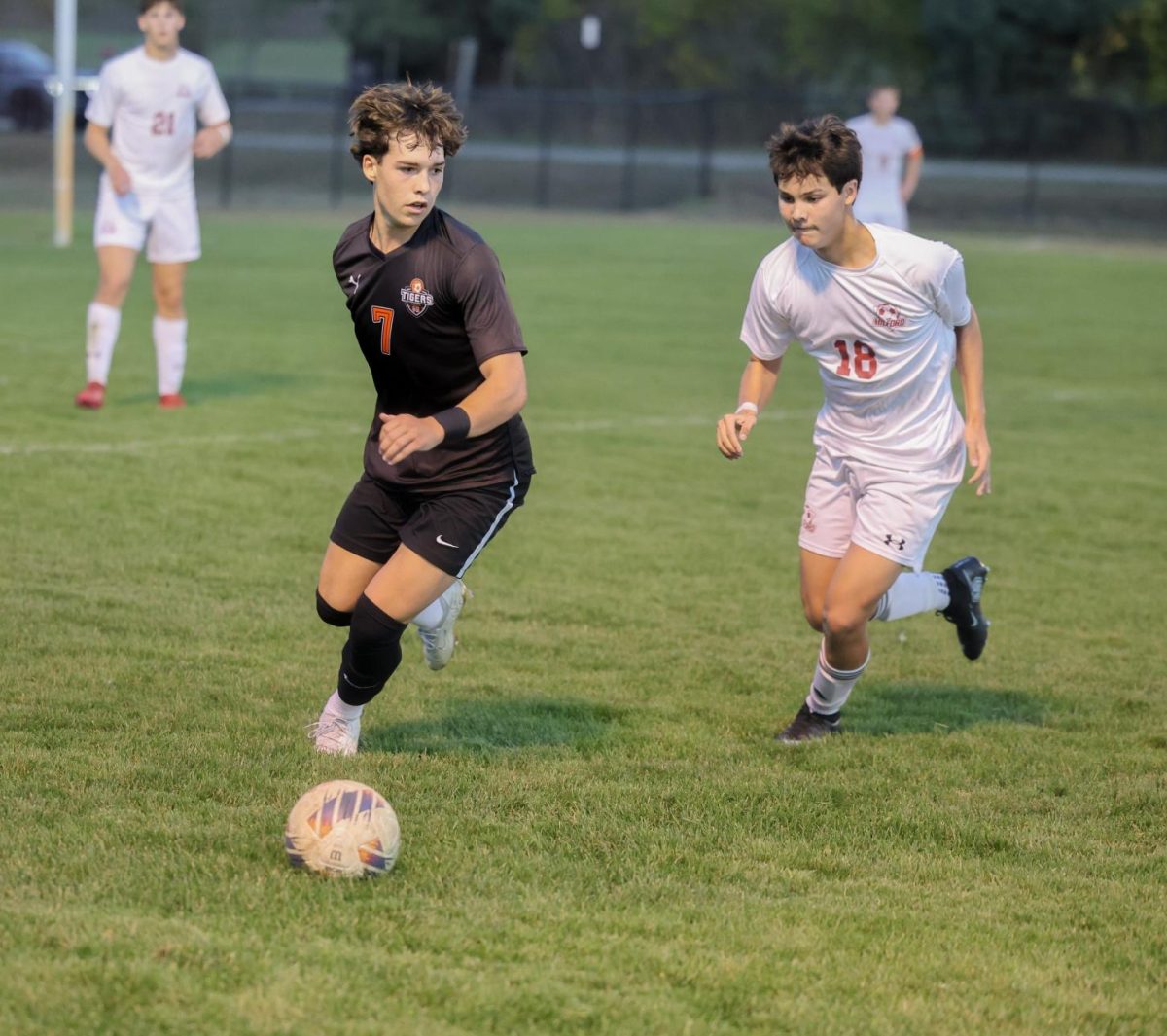 Watching his opponent, senior Dillon Hamilton prepares to kick the ball. On Oct. 6, the Fenton varsity soccer team played Milford and lost 2-4.

