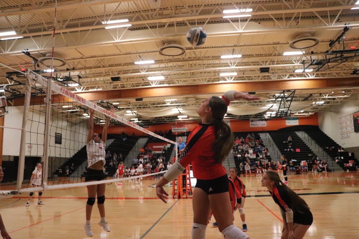 Jumping to spike the ball, freshman Riley Lawson hits the ball over the net to get a point for the team. On Oct.15 freshman volleyball plays Swartz creek and won 3-0