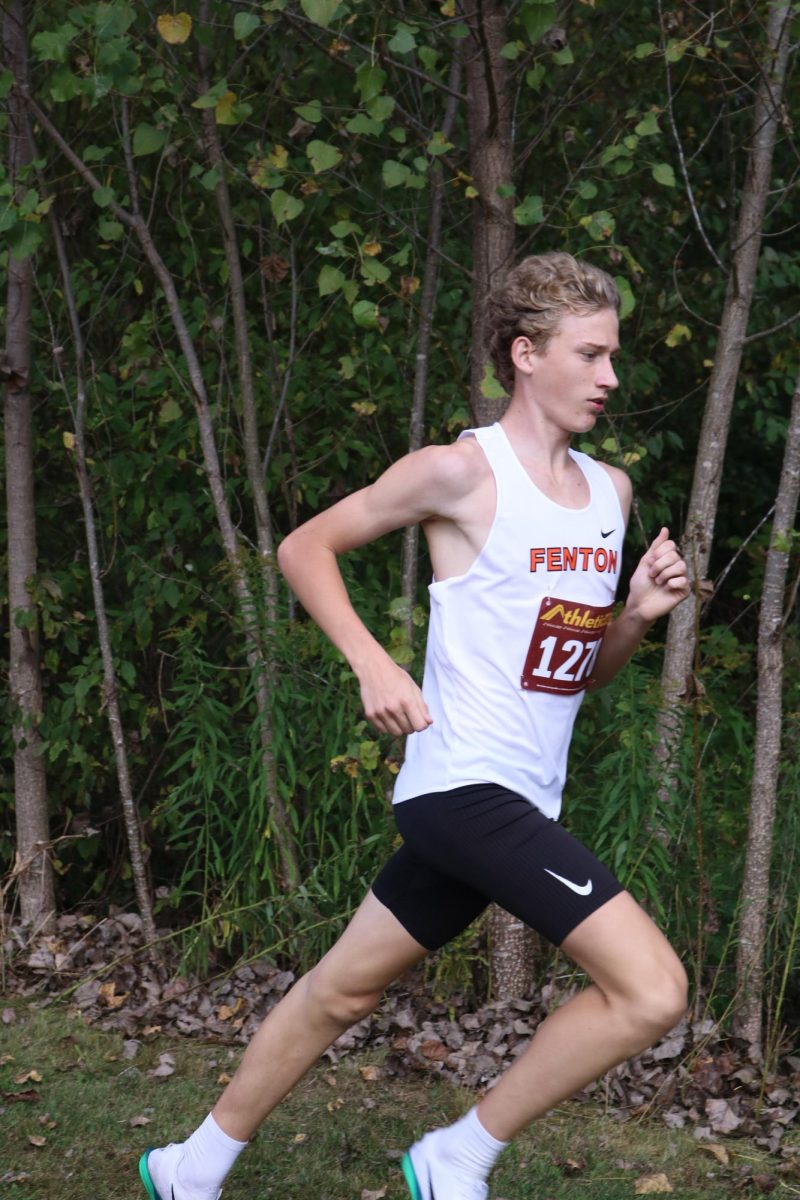 Running in a race, sophomore Gavin Katic races at Linden. On September 24, the boys' varsity cross country team placed first at FML Jamboree Number 2.
